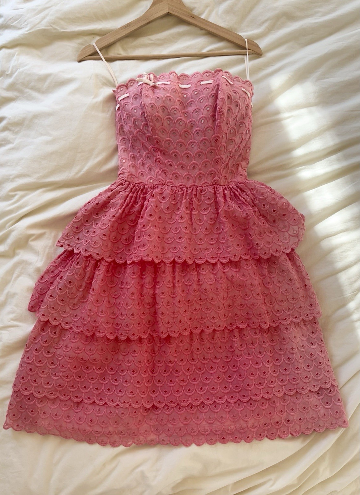 1950s pink strapless ruffle eyelet dress with white bow detail